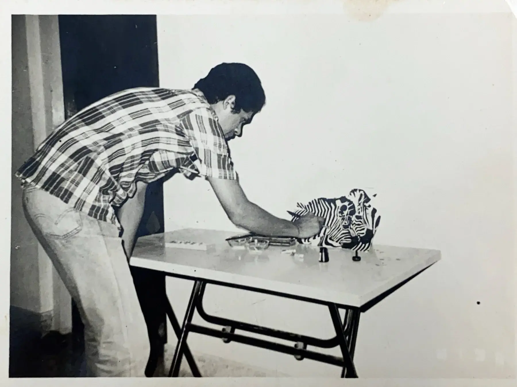 S.M. Ismail hand-crafting a zebra artwork in the studio