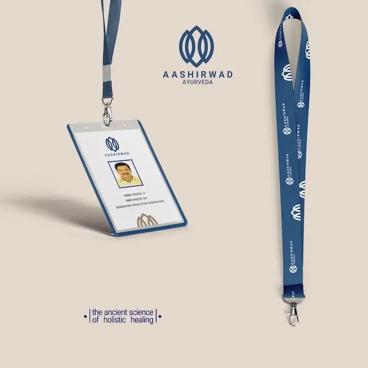 Aashirwad Ayurveda - staff ID card and branded lanyard in navy blue with tridosha mark repeat pattern