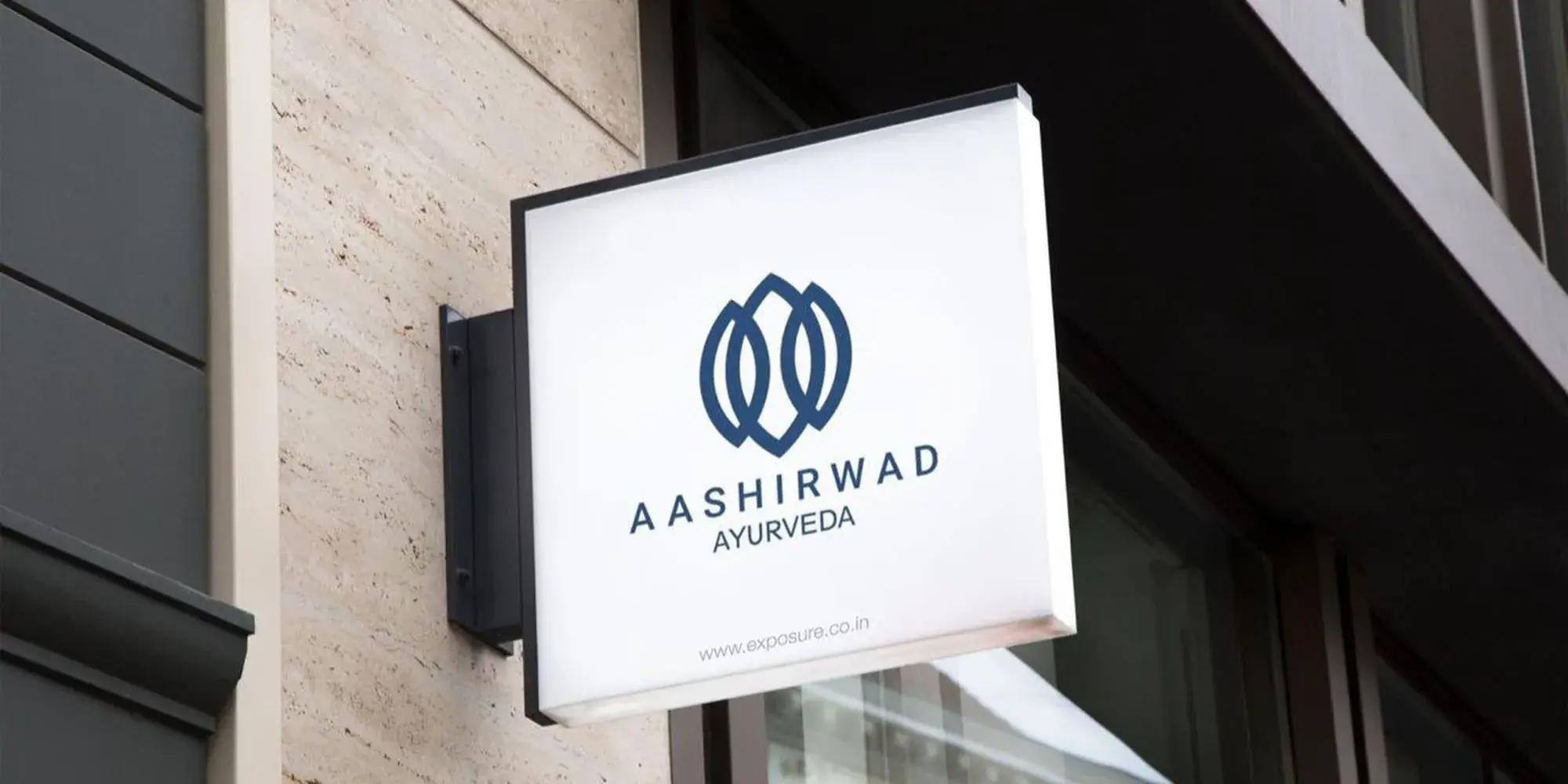 Aashirwad Ayurveda - primary brand identity mark and typography lockup on navy blue background
