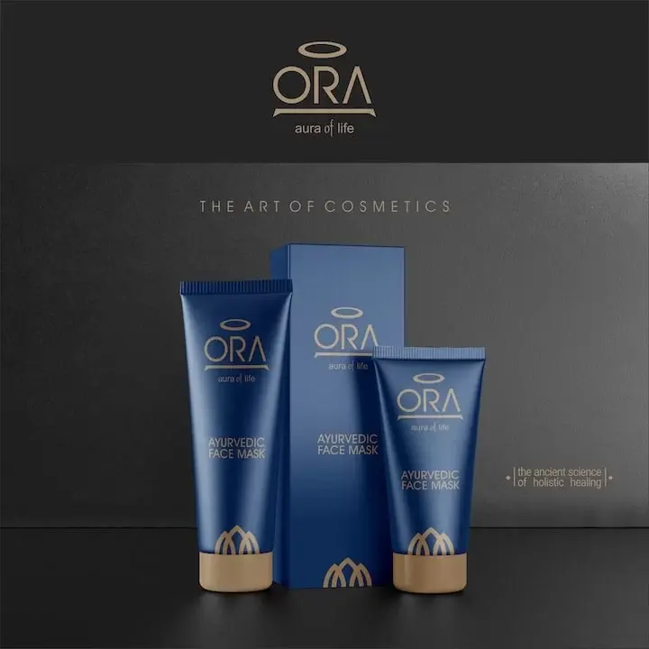 ORA - aura of life: Ayurvedic Face Mask packaging in navy blue tubes and box on dark background - premium cosmetics sub-brand of Aashirwad Ayurveda