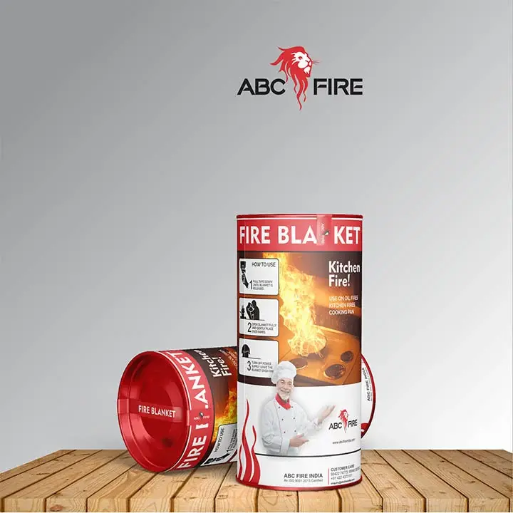 ABC Fire - Fire Blanket cylindrical tin packaging with 'Kitchen Fire!' messaging and usage instructions