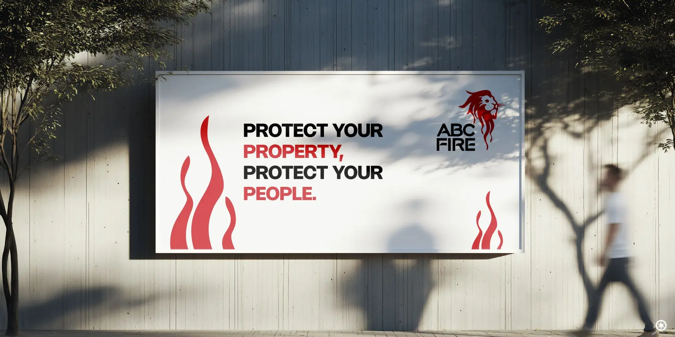 ABC Fire - 'Protect Your Property, Protect Your People.' street billboard mounted on a wall, lion mark top right, reversed-flame motif bottom left