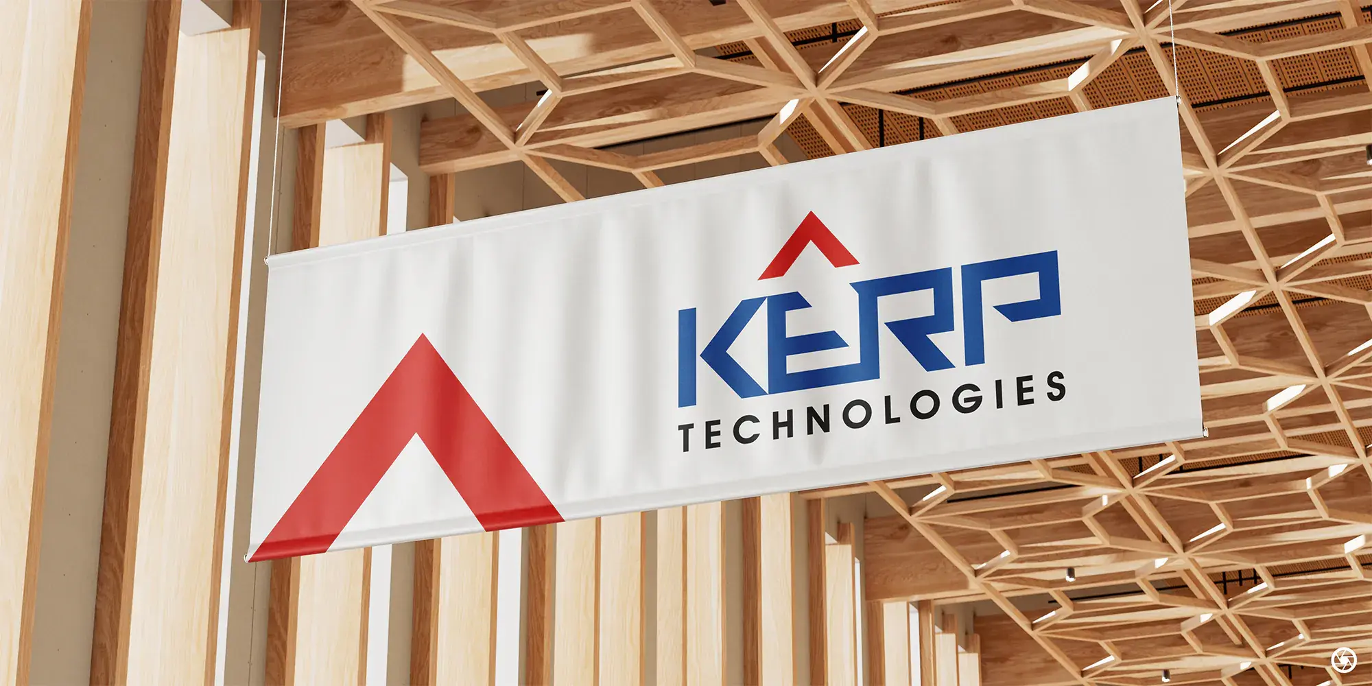 KERP Technologies hanging office sign, navy wordmark with the red peak icon, beneath a wooden-slat ceiling.