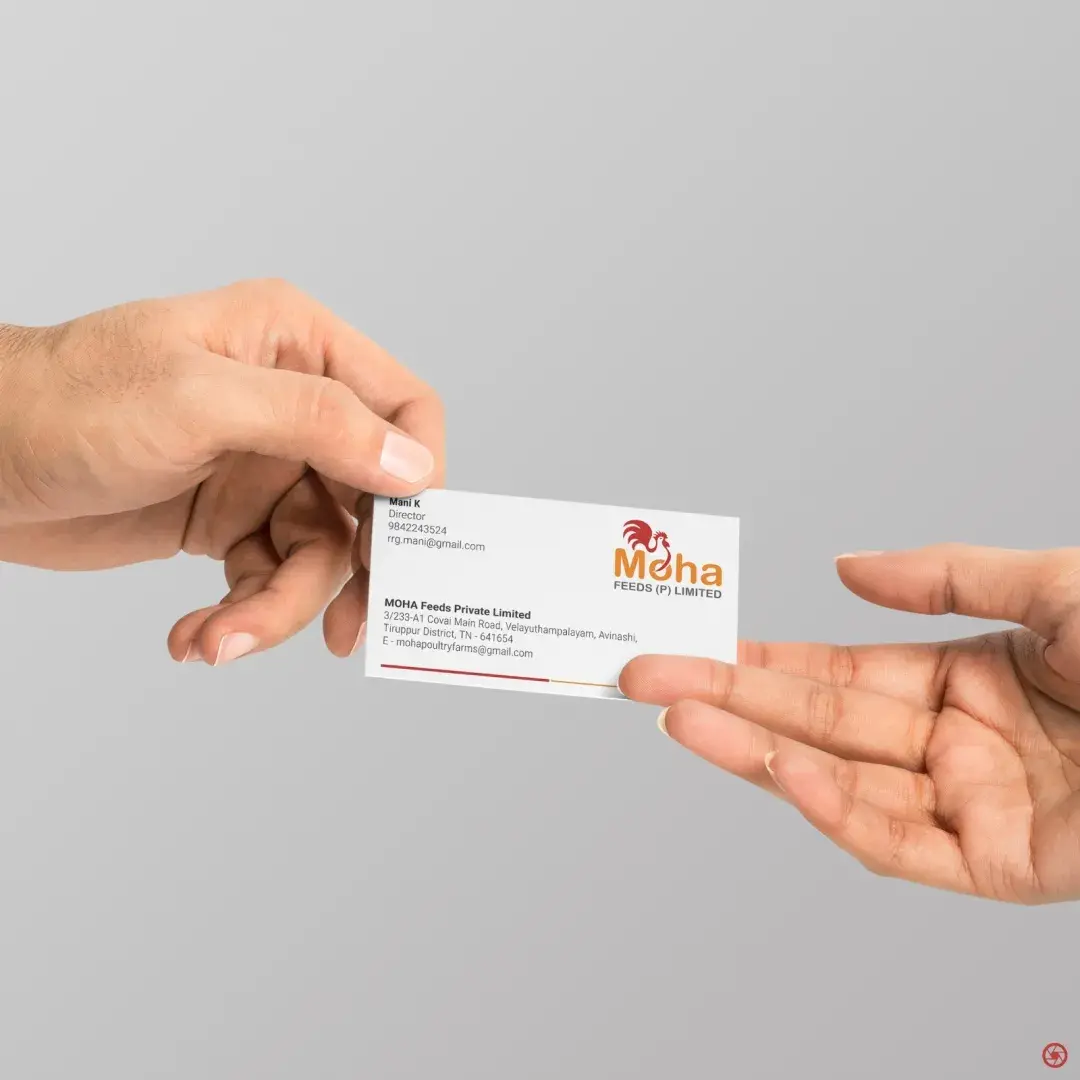 MOHA Feeds business card handed between two people - showing the card in real use