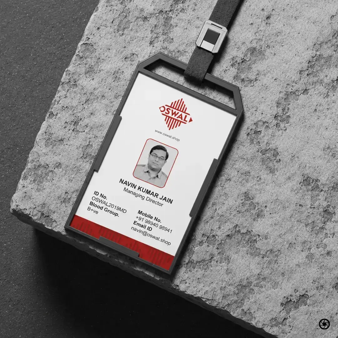 Oswal Granites & Tiles - employee ID card with Oswal diamond mark on granite surface