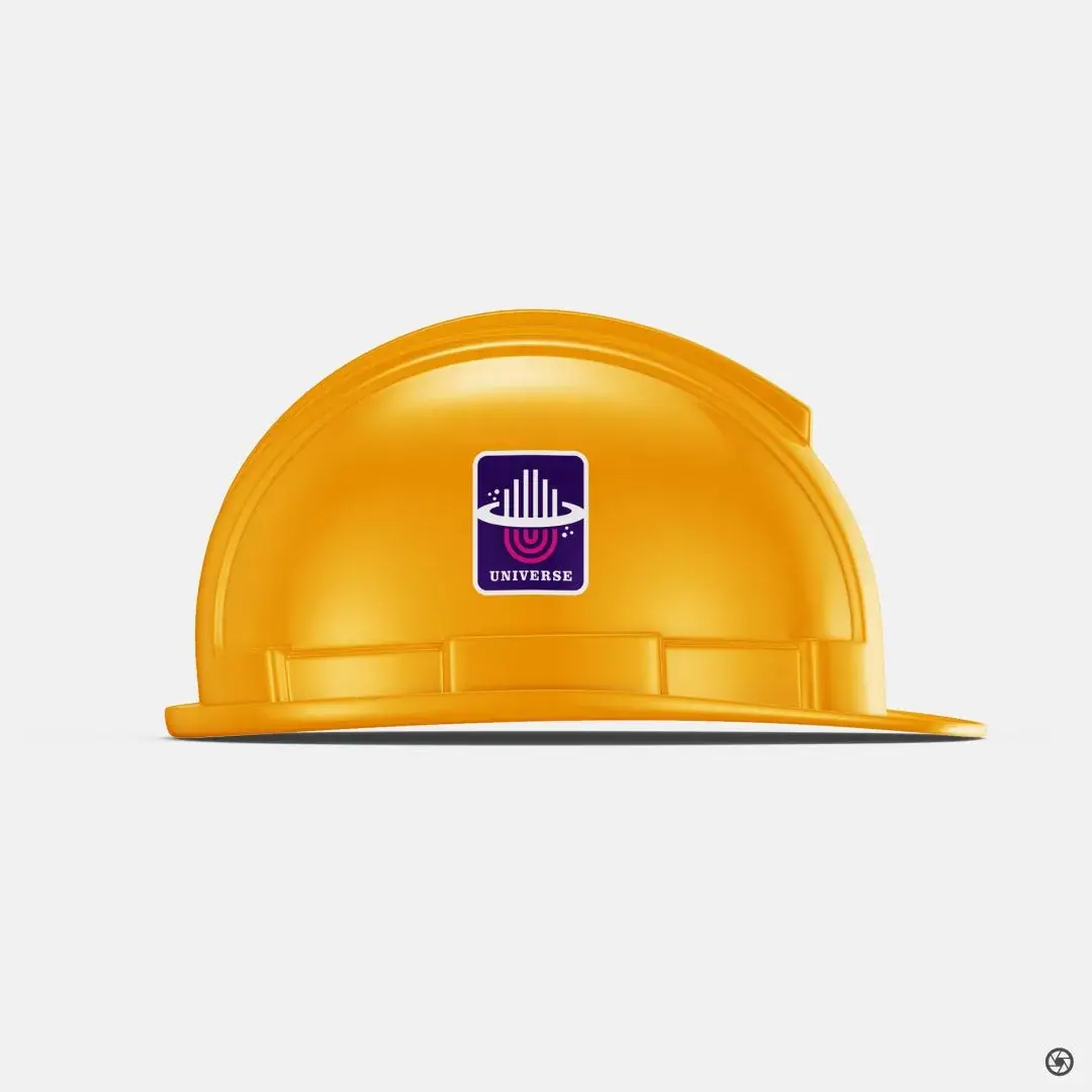 Universe Constructions - yellow construction hard hat with the Universe mark applied as a front decal, photographed straight on