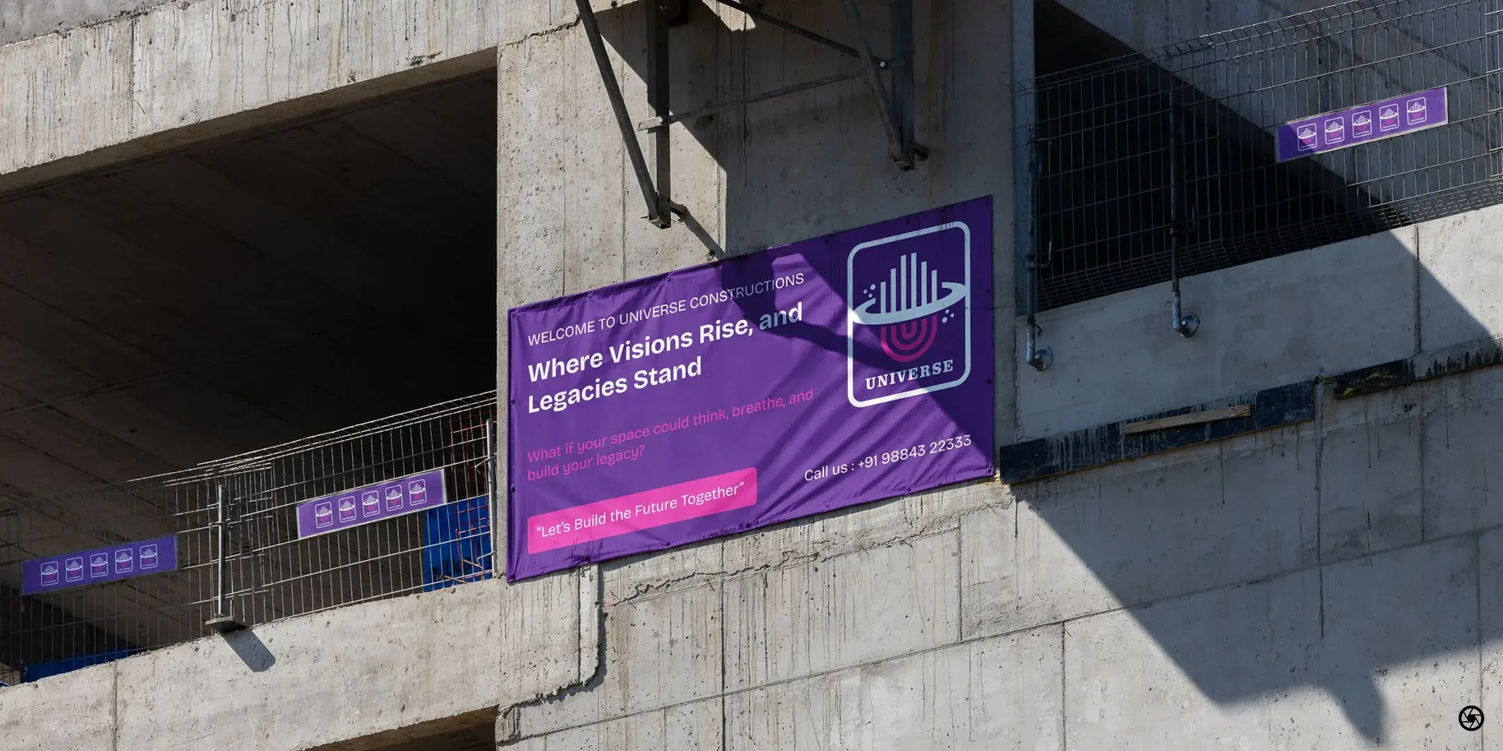 Universe Constructions - 'Where Visions Rise, and Legacies Stand' site banner mounted on a live build under construction