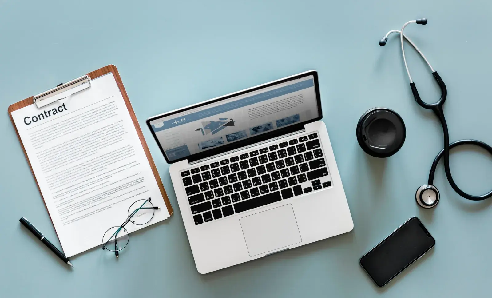 Healthcare brand touchpoints — stethoscope, patient records, and digital presence laid out together
